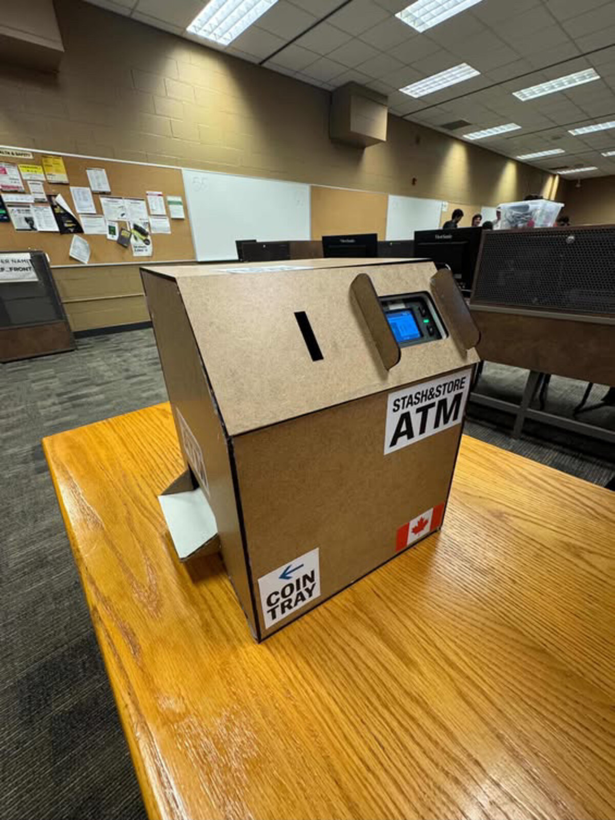 The finished Stash&Store ATM on a table, with coin slot, screen and coin tray