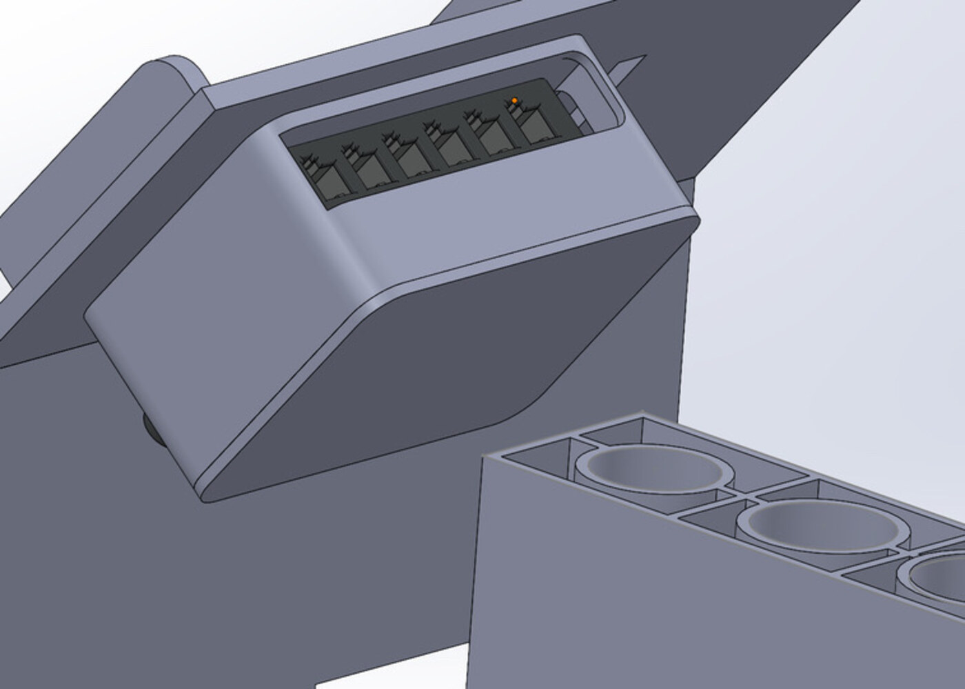 Close-up of the VEX IQ brain and the coin channel in the SolidWorks model
