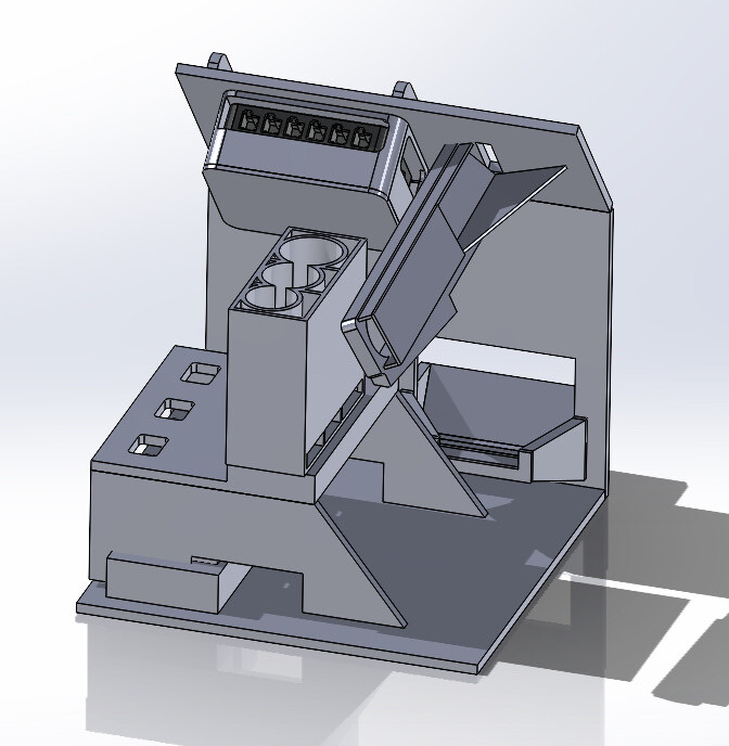 SolidWorks model of the full internal assembly: brain, coin channel, ramp and tray